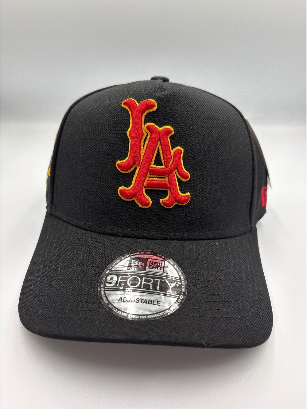 New Era 9FORTY Adjustable Black LA Baseball Cap with Red and Yellow Logo